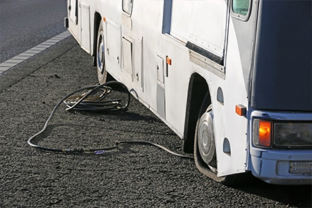 An illustration of common tire and wheel damages, relevant to RV tire insurance.